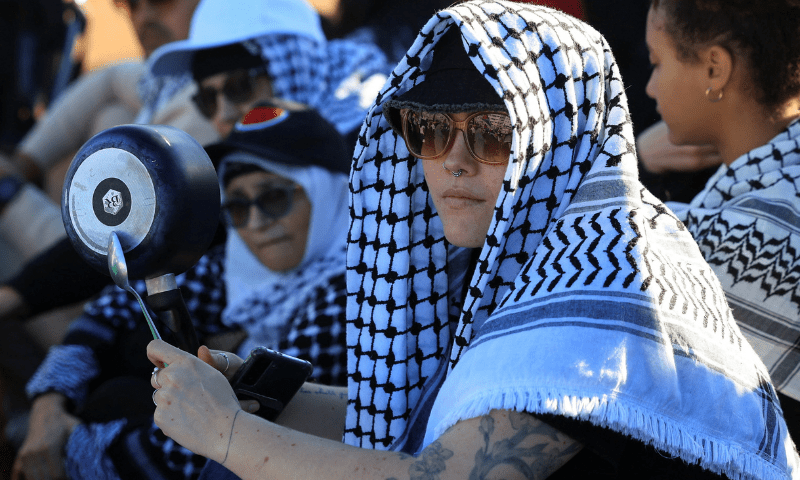  A pro-Palestinian activist holds a pot as they protest over hunger crisis in Gaza, along Sea Point Promenade in Cape Town, South Africa on July 27, 2025. &mdash; Reuters 