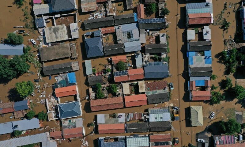 This aerial picture shows a flooded area in Miyun district, northern Beijing on July 29. — AFP