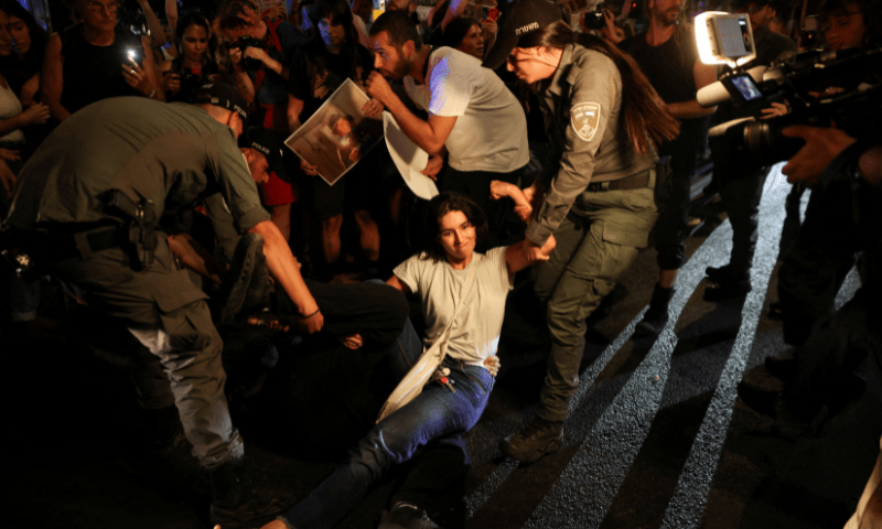  Border Police officers detain Israeli left-wing protesters taking part in a protest to show solidarity with Gaza and against the Israeli occupation in the West Bank, in Tel Aviv, Israel, on August 3, 2025. &mdash; Reuters 