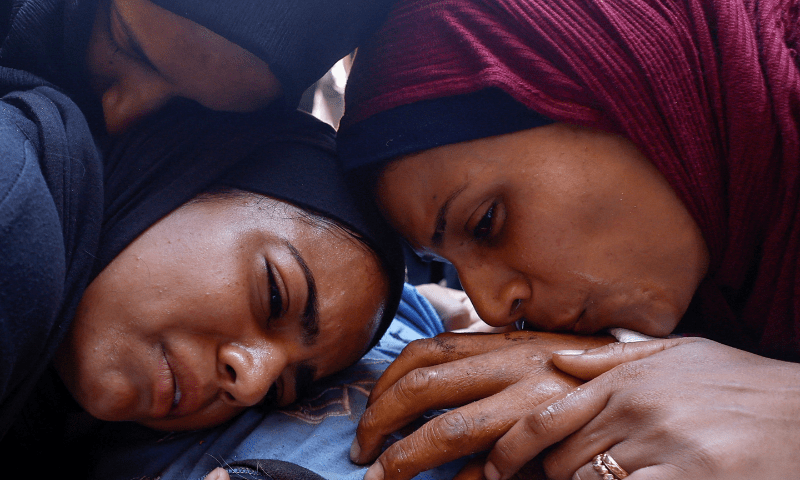  People mourn during the funeral of Palestinians, who were killed by Israeli fire while trying to receive aid on Sunday, according to medics, at Al-Shifa Hospital, in Gaza City on August 4, 2025. &mdash; Reuters 