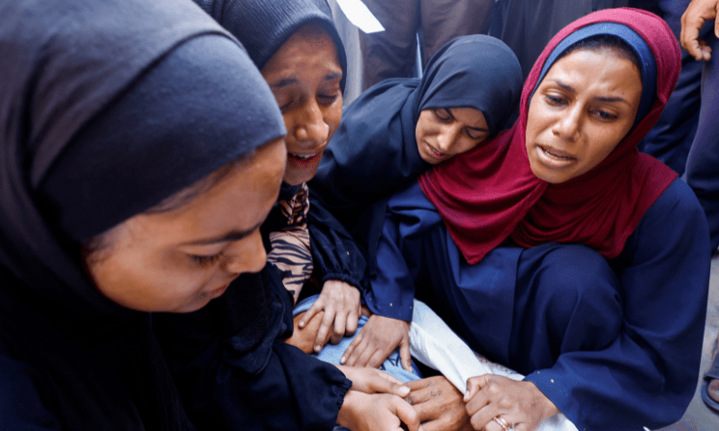  People mourn during the funeral of Palestinians, who were killed by Israeli fire while trying to receive aid on Sunday, according to medics, at Al-Shifa Hospital, in Gaza City on August 4, 2025. &mdash; Reuters 