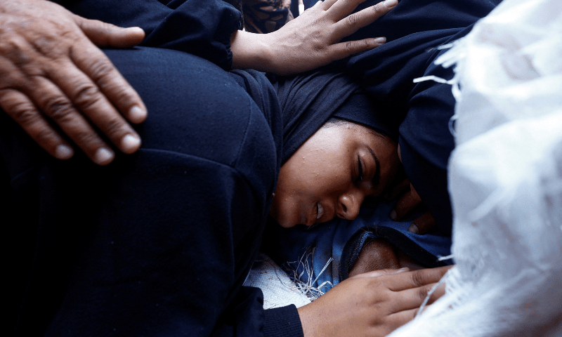  Mourners react during the funeral of Palestinians, who were killed by Israeli fire while trying to receive aid on Sunday, according to medics, at Al-Shifa Hospital, in Gaza City on August 4, 2025. &mdash; Reuters 