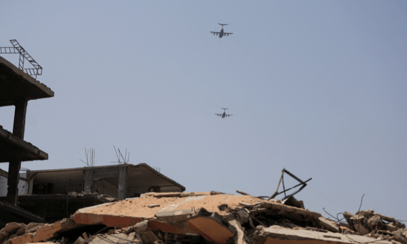  Airplanes fly during an aid airdrop mission over northern Gaza Strip on August 10, 2025. &mdash; Reuters 