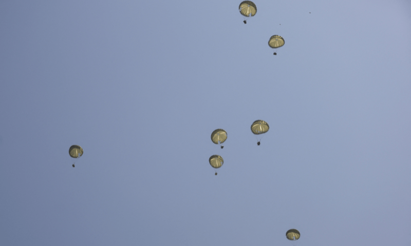  Parachutes carrying aid packages are airdropped over northern Gaza Strip on August 10, 2025. &mdash; Reuters 