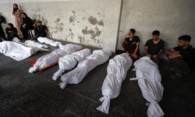 Mourners attend the funeral of Palestinians killed in Israeli strikes, according to medics, at Al-Ahli Arab Hospital in Gaza City on Aug 12, 2025. — Reuters/Dawoud Abu Alkas