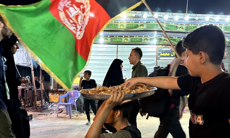 Food provided to pilgrims, who carry the flags of their country.