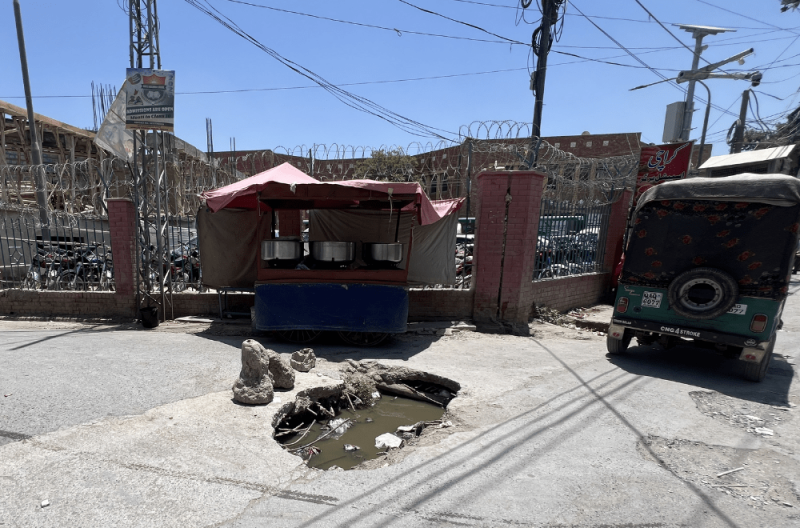 Open drainage outside the children’s hospital poses health risks and causes traffic disruptions