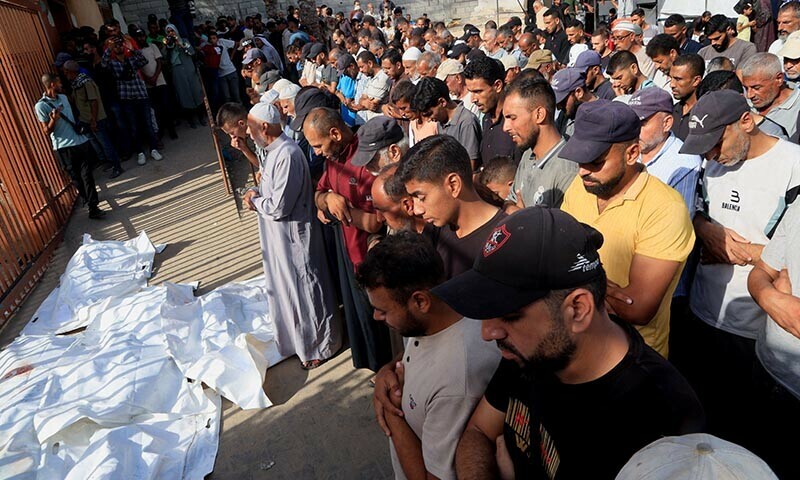 Mourners pray during the funeral of Palestinians killed in an overnight Israeli airstrike on their tent, according to medics, at Nasser Hospital in Khan Younis in the southern Gaza Strip, August 19, 2025. — Reuters