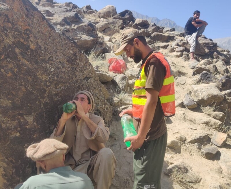 Rescue 1122 personnel carry out a rescue operation after a glacier burst in Gilgit-Baltistan blocked the Ghizer River, Aug 22. — Rescue 1122
