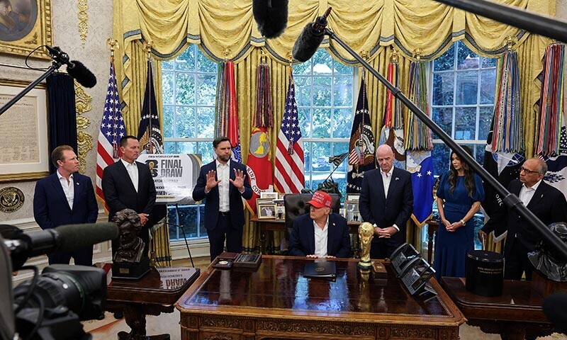 US Vice President JD Vance speaks, as US President Donald Trump sits, while FIFA president Gianni Infantino and US Homeland Security Secretary Kristi Noem stand behind the FIFA World Cup Trophy, in the Oval Office at the White House in Washington, DC, US on August 22, 2025. — Reuters