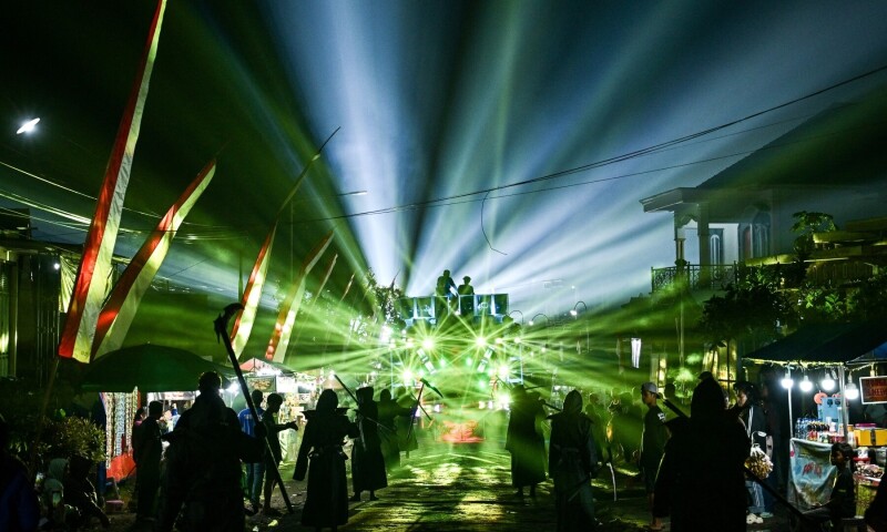 This photo taken on August 9, 2025, shows dancers performing as they follow a truck mounted with a tower of subwoofers and spotlights during a “sound horeg”, which loosely means to move or vibrate in Javanese, held as part of Indonesia’s 80th Independence Day celebrations in Malang, East Java. — AFP