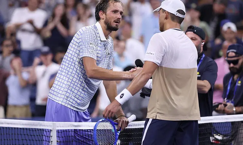 Benjamin Bonzi of France (R) greets Daniil Medvedev after winning in five sets during their Men’s Singles First Round match on Day One of the 2025 US Open at USTA Billie Jean King National Tennis Center on August 24, 2025 in the Flushing neighborhood of the Queens borough of New York City. — AFP