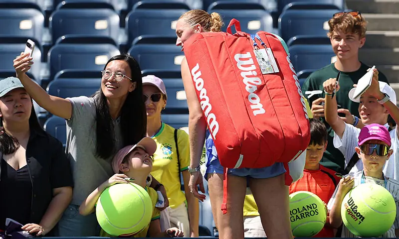 Petra Kvitova of the Czech Republic takes photos with fans after her Women&rsquo;s Singles First Round match against Diane Parry of France for her final match before retiring on Day Two of the 2025 US Open at USTA Billie Jean King National Tennis Center on August 25, 2025 in the Flushing neighborhood of the Queens borough of New York City. &mdash; AFP