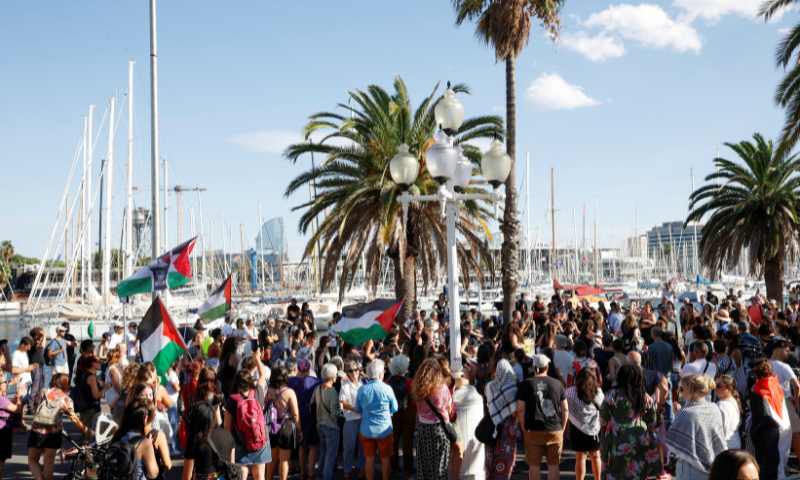 Activists gather at the launch of the Global Sumud humanitarian flotilla to Gaza, in the port of Barcelona, Spain, on August 29, 2025. &mdash; Reuters