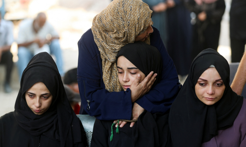 Mourners react during the funeral of Palestinians who were killed by Israeli fire while trying to receive aid and another killed in a strike on Friday, according to medics, at Al-Shifa Hospital in Gaza City, on August 30, 2025. &mdash; Reuters