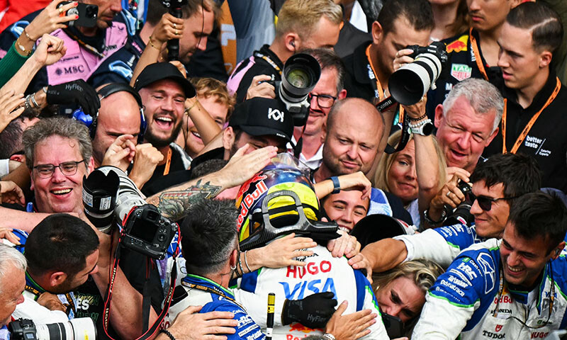 Third-placed RB’s French driver Isack Hadjar celebrates with his team for his first Formula One podium after the Formula One Dutch Grand Prix at The Circuit Zandvoort, western Netherlands, on August 31, 2025. — AFP