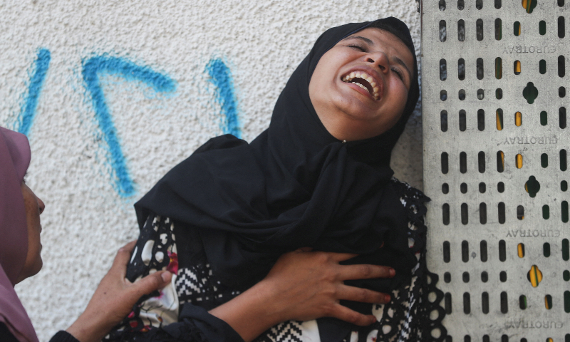  Mourners react during the funeral of Palestinians killed in overnight Israeli strikes, according to medics, at Al-Shifa Hospital in Gaza City on September 3, 2025. &mdash; Reuters/Mahmoud Issa 