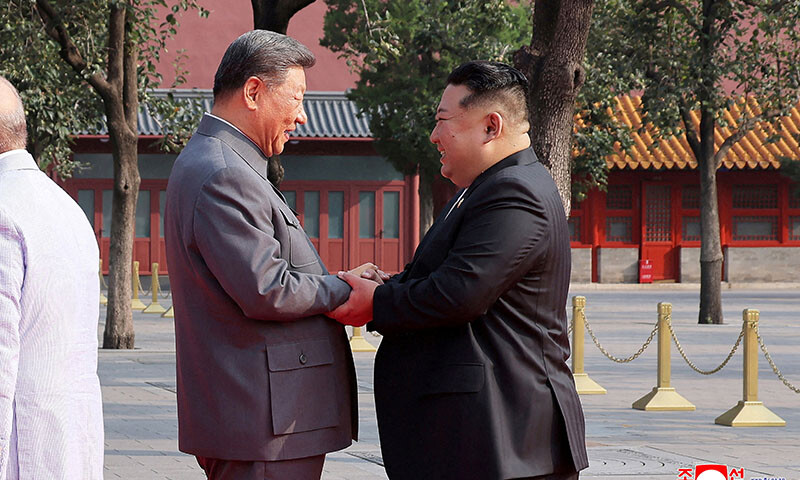 North Korean leader Kim Jong Un shakes hands with Chinese President Xi Jinping as they attend a military parade marking the 80th anniversary of the end of World War Two in Beijing, China on September 3. — Reuters