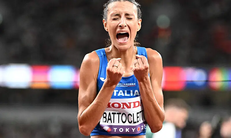 Second placed Italy’s athlete Nadia Battocletti celebrates at the end of the women’s 10000m final during the World Athletics Championships in Tokyo on September 13, 2025. (Photo by Jewel SAMAD / AFP)