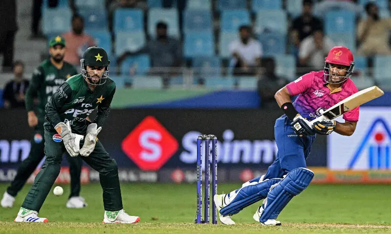 UAE’s Muhammad Zohaib (R) watches the ball after playing a shot as Pakistan’s wicketkeeper Mohammad Haris looks on during the Asia Cup 2025 Twenty20 international cricket match between United Arab Emirates and Pakistan at the Dubai International Stadium in Dubai on September 17, 2025 — AFP