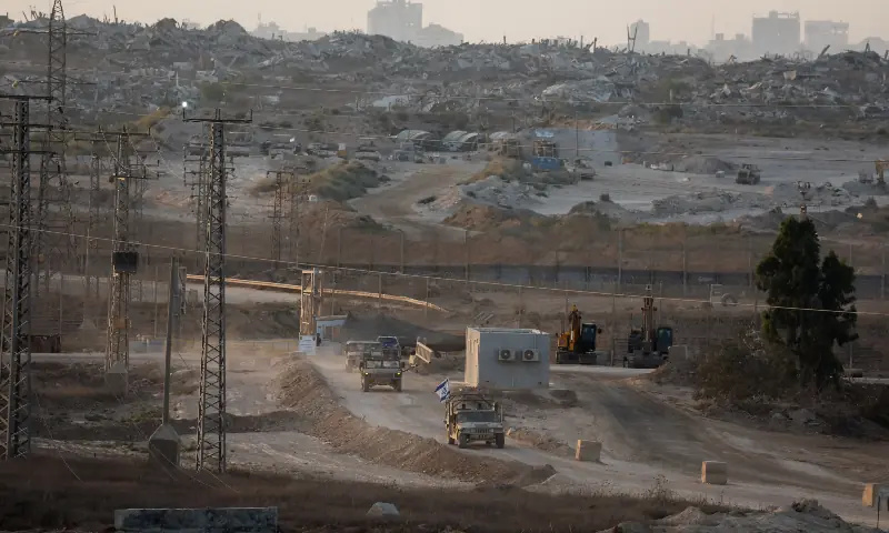 Israeli military vehicles manoeuvre near the Israel-Gaza border, as seen from Israel on September 18, 2025. — Reuters