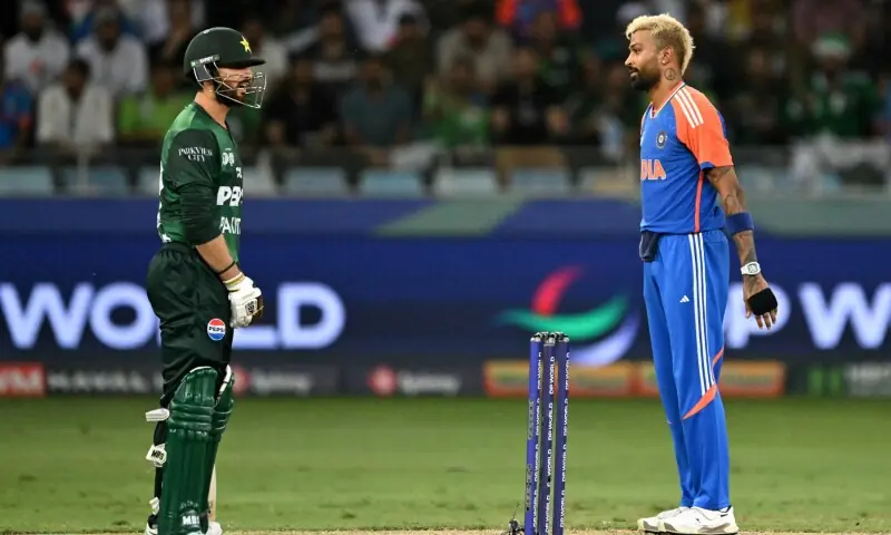 India’s Hardik Pandya (R) looks at Pakistan’s captain Salman Agha during the Asia Cup 2025 Super Four Twenty20 international cricket match between India and Pakistan at the Dubai International Stadium in Dubai on September 21, 2025. — AFP