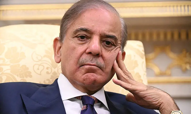 Prime Minister Shehbaz Sharif waits for US President Donald Trump to finish signing executive orders ahead of their meeting in the Oval Office of the White House in Washington, DC on September 25. — AFP