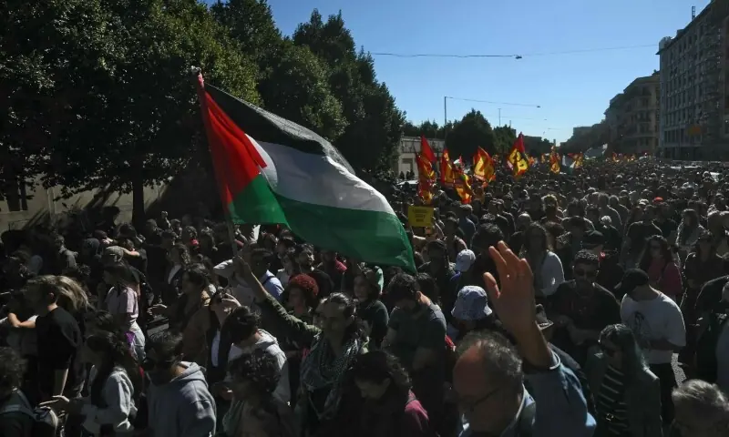 People take part in a protest in solidarity with Palestinians and to condemn the interception of the Global Sumud Flotilla by the Israeli army, in Milan on October 3. — AFP