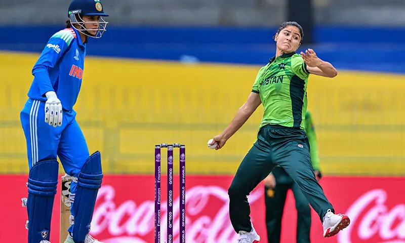 Pakistan's Diana Baig (R) bowls as Smriti Mandhana of India observe during the Crick World Cup Cup 2025 International (ODI) Crick Party between India and Pakistan in the R. R. Proven International Cricket Stadium in Colombo on October 5, 2025.-AFP.