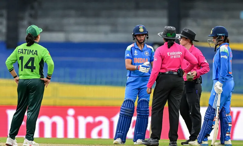 India&rsquo;s captain Harmanpreet Kaur (2L) speaks with the field umpires as her Pakistan&rsquo;s counterpart Fatima Sana (L) watches during the ICC Women&rsquo;s Cricket World Cup 2025 ODI match between India and Pakistan at the R. Premadasa International Cricket Stadium in Colombo on October 5, 2025. &mdash; AFP