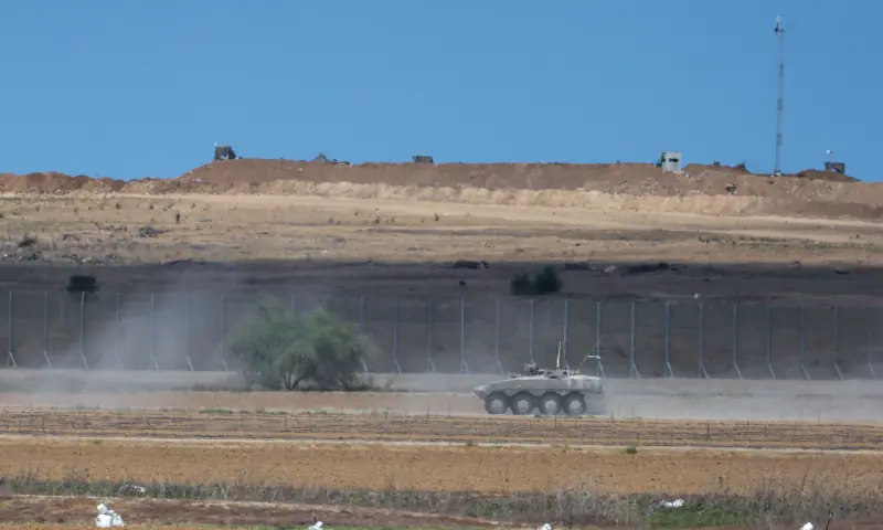 An Israeli military armoured vehicle patrols along the Israel-Gaza border area on October 9, 2025. — AFP