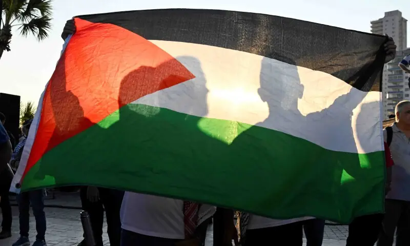 People hold a Palestinian flag during a rally in support of Palestinians in Gaza, after U.S. President Donald Trump announced that Israel and Hamas agreed on the first phase of a Gaza ceasefire, in Havana, Cuba October 9. &mdash; Reuters
