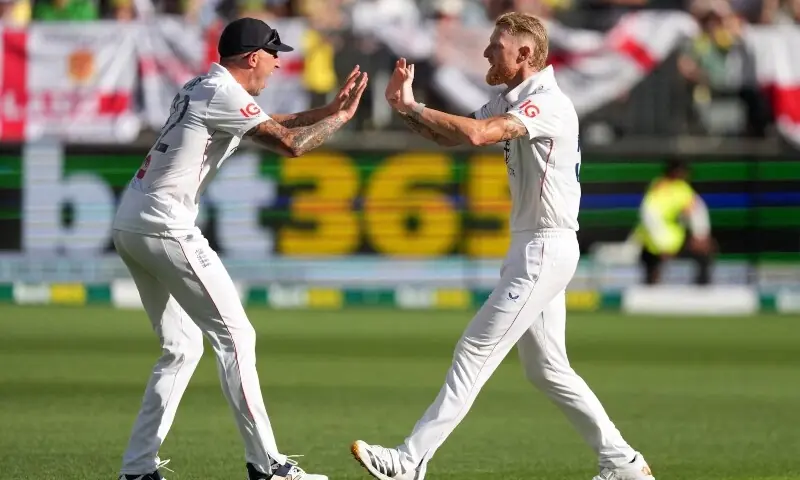 England’s Brydon Carse celebrates after taking a catch to dismiss Australia’s Travis Head off the bowling of England’s Ben Stokes. — Reuters