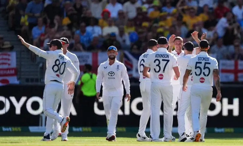 England’s Brydon Carse celebrates after taking the wicket of Australia’s Usman Khawaja, caught out by Jamie Smith. — Reuters