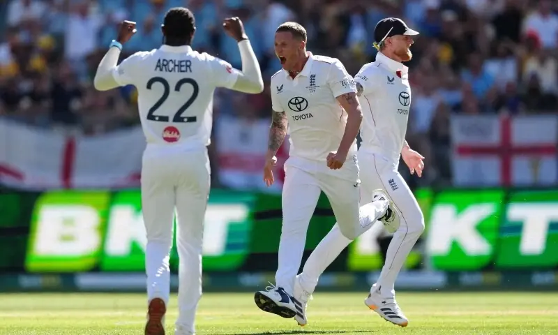 England’s Brydon Carse celebrates with Ben Stokes and Jofra Archer after taking the wicket of Australia’s Steve Smith, caught out by Harry Brook. — Reuters