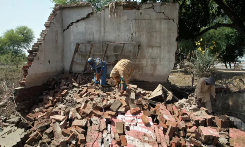 Residents work at a damaged property, following monsoon rains and flooding, in Punjab on September 17, 2025. — Reuters