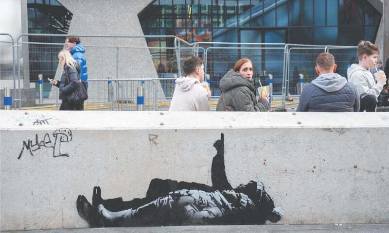 Street artist Banksy unveils mural in London