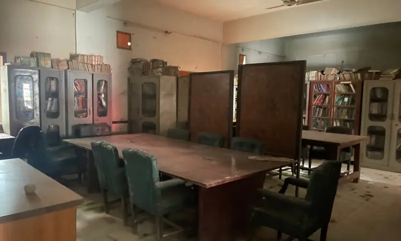  Dusty tables and chairs at the library relocated to the football house. 