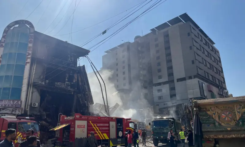  Rescue teams clear debris of Gul Plaza building that collapsed after a blaze ripped through it. 