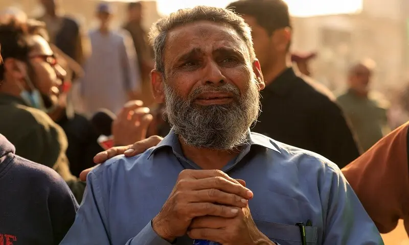 Shafi Ahmed, who owned a store in the basement, grieves for missing friends following a massive fire that broke out in the Gul Plaza Shopping Mall in Karachi, Pakistan. — Reuters