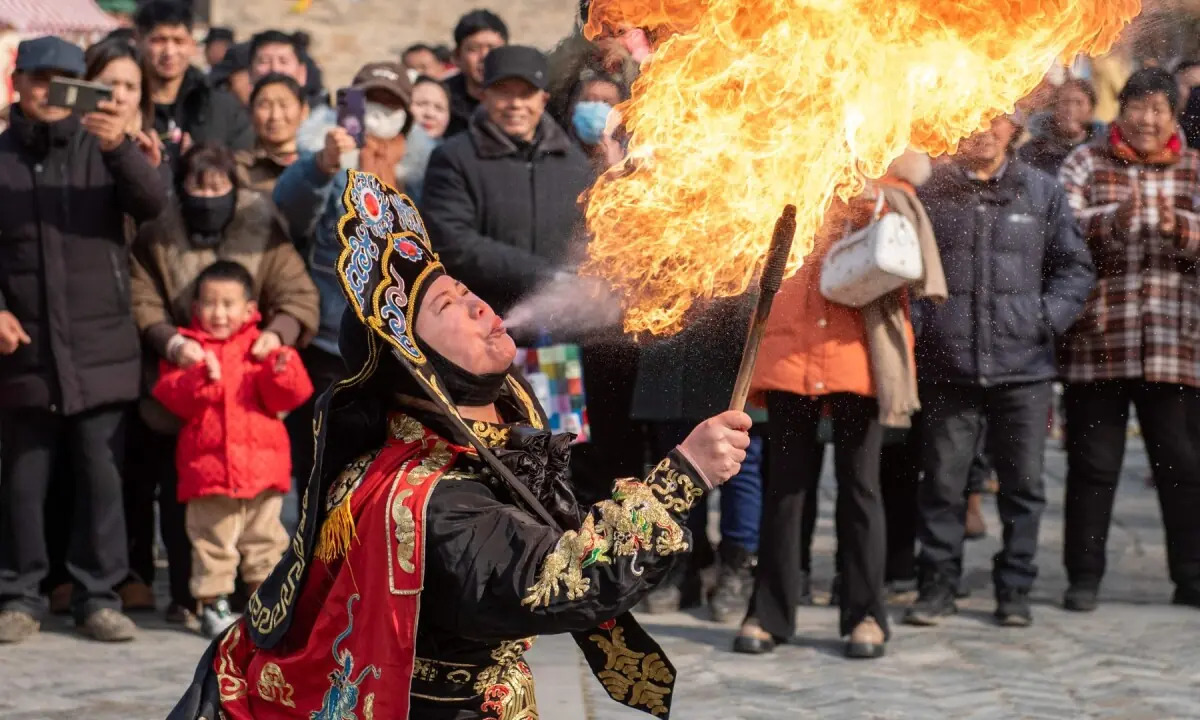 A folk performer breathes fire during a performance ahead of Lunar New Year celebrations in a village in Huai&rsquo;an, in China&rsquo;s eastern Jiangsu Province on February 7, 2026. &mdash;AFP
