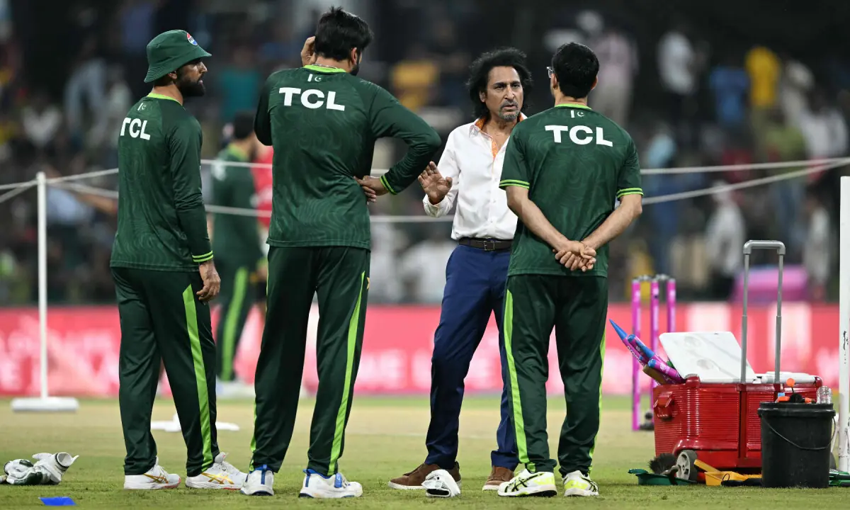 Former Pakistani cricketer Ramiz Raja (2R) interacts with Pakistan&rsquo;s players before the start of the 2026 ICC Men&rsquo;s T20 Cricket World Cup group stage match between Pakistan and USA at the Sinhalese Sports Club (SSC) Ground in Colombo on February 10, 2026. &mdash; AFP