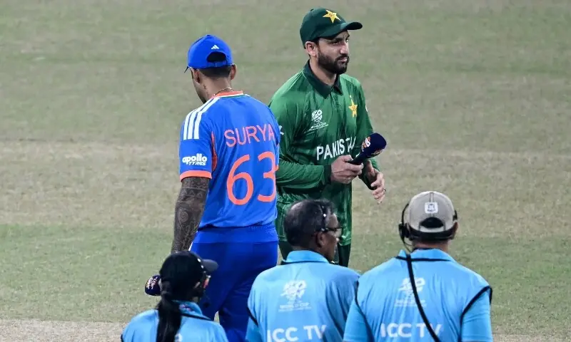 Pakistan’s captain Salman Agha (back R) walks past his Indian counterpart Suryakumar Yadav (back R) after the toss before the start of the 2026 ICC Men’s T20 Cricket World Cup group stage match between India and Pakistan at the R Premadasa Stadium in Colombo on February 15, 2026. — AFP
