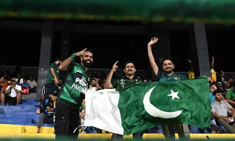  Pakistan fans wave their country&rsquo;s national flag as rain delayed the start of the 2026 ICC Men&rsquo;s T20 Cricket World Cup Super Eight match between Pakistan and New Zealand at the R Premadasa Stadium in Colombo on February 21, 2026. &mdash; AFP 