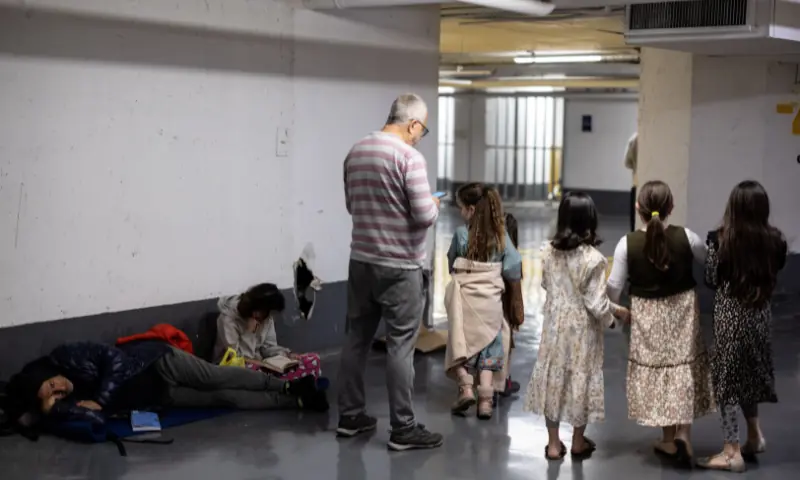 Israelis take shelter in an underground parking lot after missiles were launched towards Israel from Iran following strikes by Israel and the US on Iran, in Tel Aviv, Israel, February 28, 2026. &mdash; Reuters