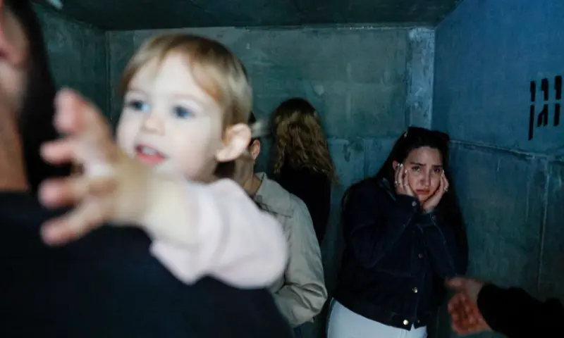 People take shelter, after missiles were launched from Iran towards Israel, following Israel and US strikes on Iran, in Ashkelon, Israel, February 28, 2026. &mdash; Reuters