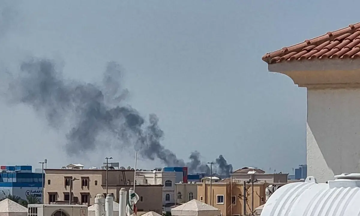 A smoke plume rises over Abu Dhabi from the site of an Iranian missile strike on Feb 28, 2026. — AFP