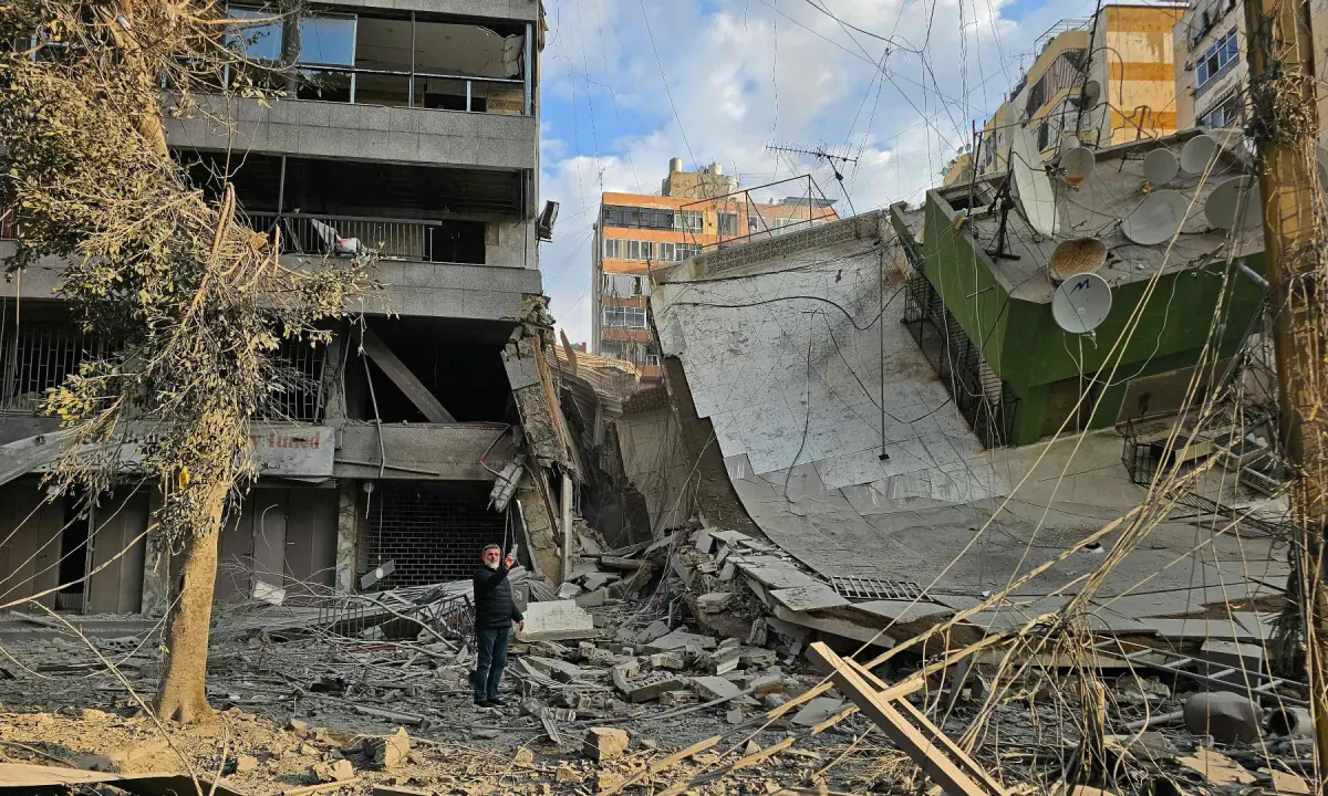  A man inspects the debris of destroyed buildings at the site of an Israeli airstrike that targeted Haret Hreik neighbourhood in Beirut&rsquo;s southern suburbs, on March 7, 2026. &mdash; AFP 