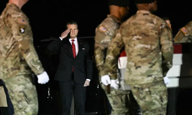 US Secretary of Defence Pete Hegseth salutes as members of a US Army team carry a flag-draped transfer case containing the remains of Sgt. Benjamin N. Pennington, 26, of Glendale, Kentucky, during a dignified transfer solemn event at Dover Air Force Base, in Dover, Delaware, on March 9, 2026. &mdash; AFP
