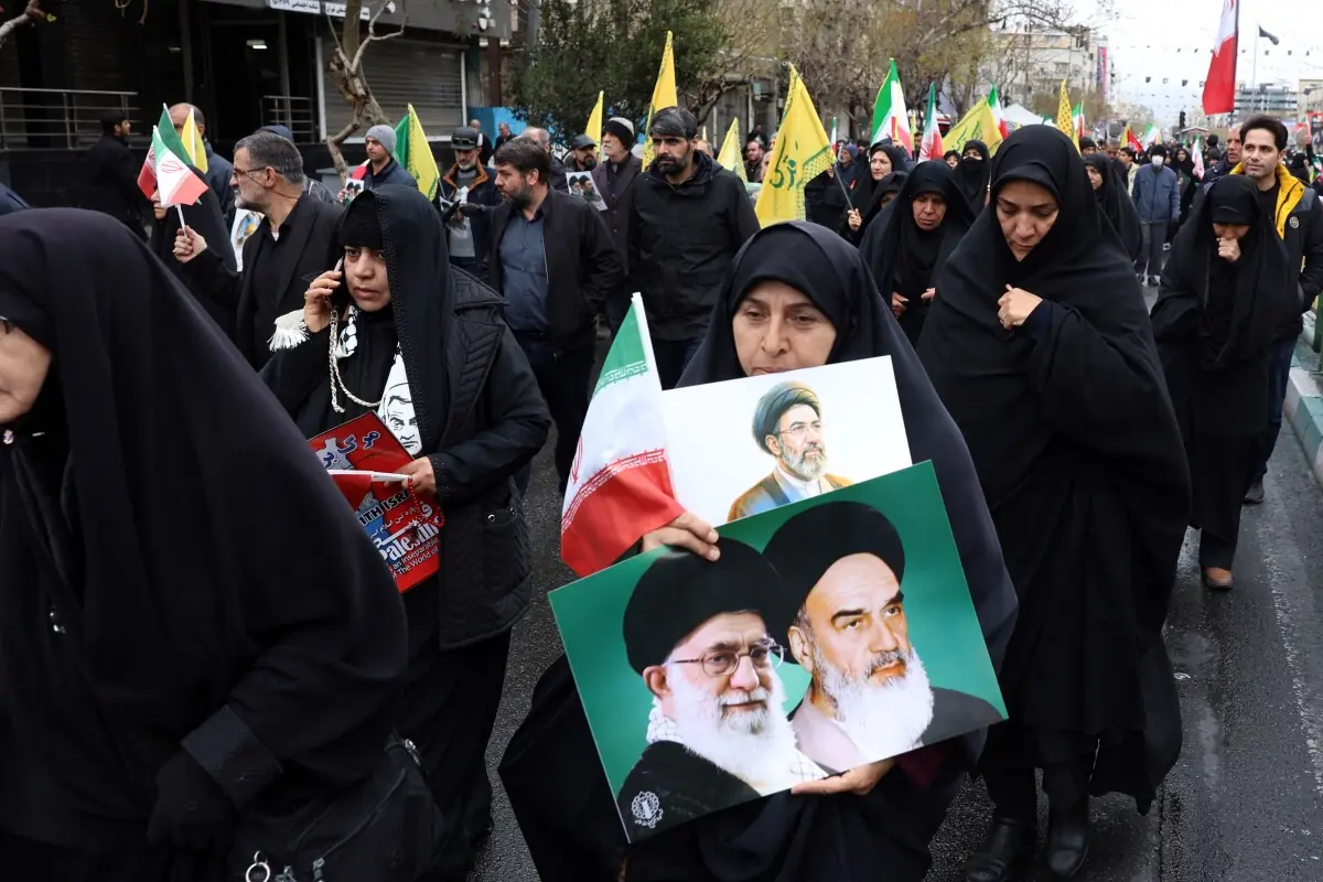Iranians hold up posters as they take part in the Al-Quds (Jerusalem) Day rally, a commemoration in support of the Palestinian people on the last Friday of the Islamic holy month of Ramadan, in Tehran on March 13, 2026. &mdash; AFP